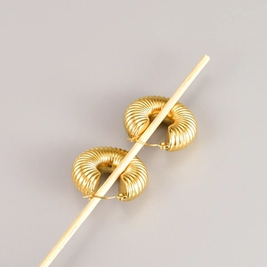 Retro hollow geometric hoop earrings in gold with a vintage textured spiral design