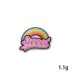 Detailed size view of rainbow embroidery patch with Sweet lettering 5.8cm x 4.2cm