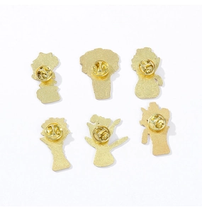 Detail view of six golden enamel pin backs with secure butterfly clutch fasteners