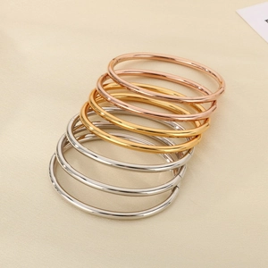Polished stainless steel round bangles in gold, rose gold and silver finishes