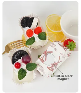 Detail of artificial cupcake magnet with berries and built-in magnet for home decor