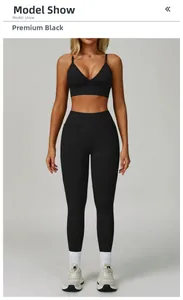 Macro shot of seamless high-elastic black yoga bra and matching high-waisted leggings