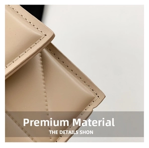 Close-up of beige PU leather with elegant diagonal quilting and fine stitching detail