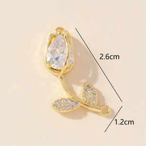 Detailed view of tulip jewelry connector with gold metal and clear cubic zirconia 2.6cm