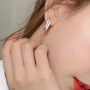 Fashionable silver-tone double-row micro-set zircon hoop earrings on model ear