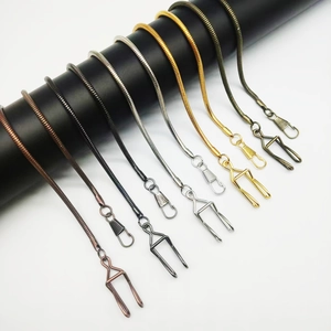 Detailed close-up of alloy lobster clasps and snake chains in various metallic plating finishes