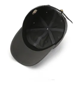 Detail view of the gray baseball cap interior with sweatband and adjustable metal buckle