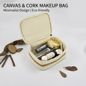 Off-white cotton canvas makeup bag with cork trim and double zippers in open storage view