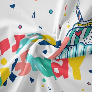 Detail showing the soft fabric texture and colorful Happy Birthday doodle prints