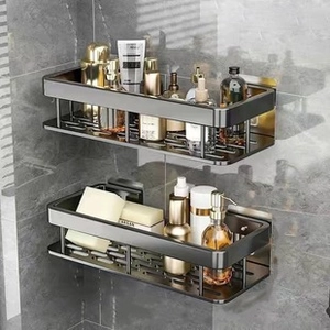 Two-tier black metal corner shower caddy mounted on bathroom wall with toiletries