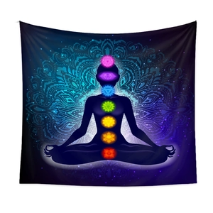 Detail of meditation tapestry with seven chakra symbols and mandala background
