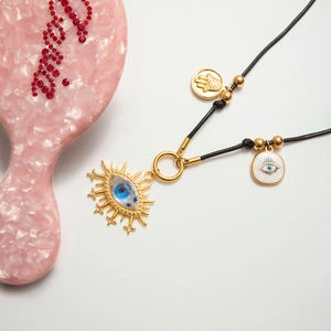 18K gold stainless steel necklace with blue evil eye hamsa charm on black wax cord