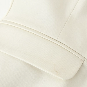 Beige twill square neck vest featuring detailed pocket stitching and soft woven texture