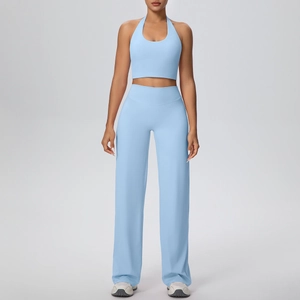 Close-up of light blue yoga set featuring a halter neck top and wide-leg sport trousers