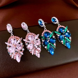 Macro shot of vintage style waterdrop earrings with pink and blue crystal clusters