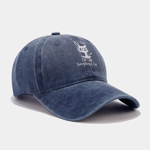 Distressed dark blue washed cotton baseball cap with humorous cartoon cat print
