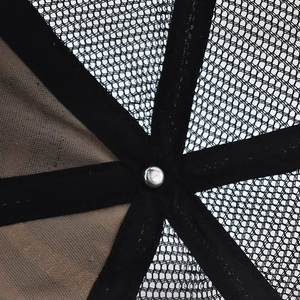 Detailed macro view of the interior mesh structure and silver rivet of the baseball cap
