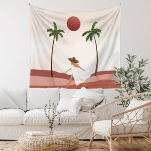 Detail of bohemian tapestry featuring minimalist desert sun and walking woman illustration