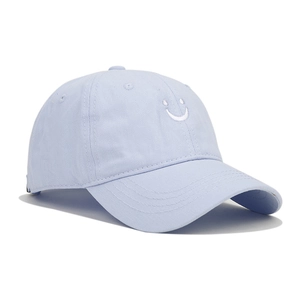 Detail of light blue cotton baseball cap featuring white smile embroidery on the front