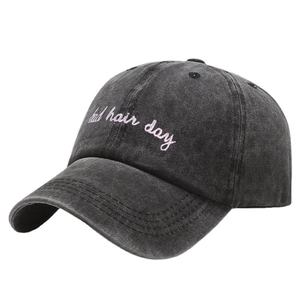 Dark grey washed denim baseball cap with pink bad hair day embroidery and curved brim
