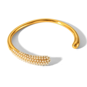 Elegant gold-plated stainless steel cuff bracelet with asymmetrical micro pearl inlay detail