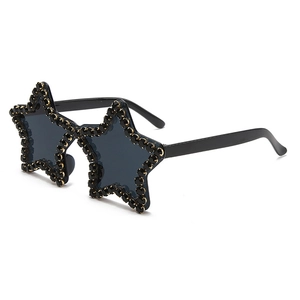Detail showing hand-set black rhinestones on star-shaped rimless sunglasses frame