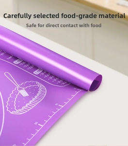 Macro detail of purple silicone baking mat showing measurement scales and conversion tables