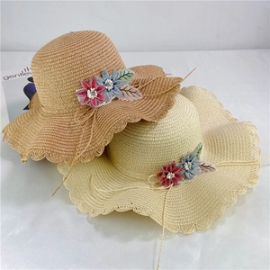 Women's wide brim straw sun hat with floral lace and wavy edges in khaki and beige