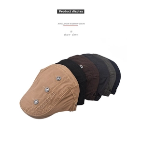Close-up of cotton beret hats featuring 'FREESTYLE' embroidery and metal eyelet details