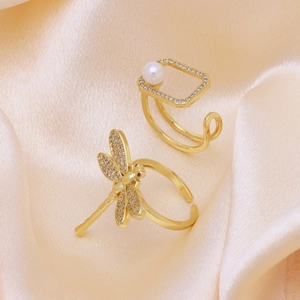 Luxurious 18k gold plated dragonfly and geometric pearl ring set on golden silk fabric