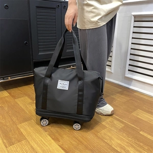 Black expandable travel bag with wheels, waterproof storage for business and school