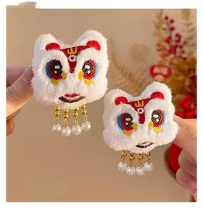 Detail of New Year lion dance hair clips with white faux fur and pearl tassels