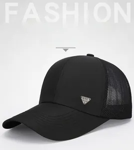 Detail of black breathable mesh baseball cap featuring a metal Spirit shield badge