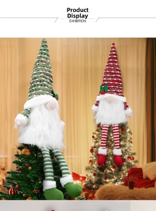 Detail of Nordic forest gnome tree toppers with striped hats and long dangling legs