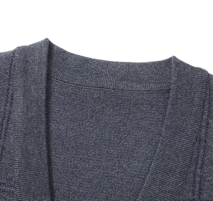 Close-up of ribbed V-neck collar detail on dark grey knitted vest for men