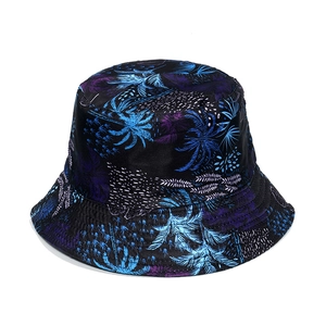 Detailed view of reinforced stitching on tropical palm leaf print sun hat