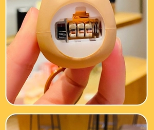 Detail showing the battery compartment of Capybara keychain with three button cells