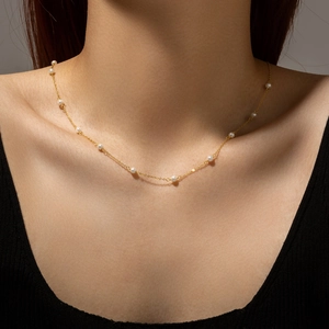 Elegant gold pearl necklace for women featuring minimalist handmade beaded chain design