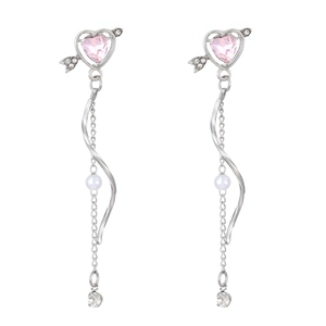 Detail of silver Cupid's arrow drop earrings with pink heart stone and fringe