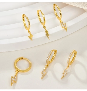 Macro shot of S925 sterling silver lightning earrings with cubic zirconia and gold plating