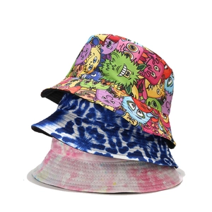 Three-tier stack of printed bucket hats featuring graffiti and colorful tie-dye patterns