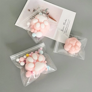 Pink cat paw EVA jewelry bags with colorful pom poms and zipper seal packaging