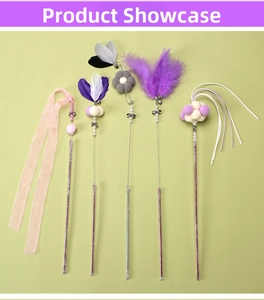 Detail of 5-piece cat teaser wand set featuring feathers, bells, and ribbons on pink wands