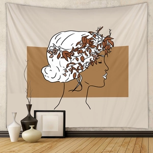 Close-up of minimalist line art wall tapestry with warm geometric shapes and floral details