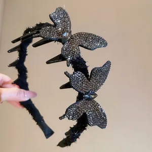 Elegant black rhinestone butterfly headband with feather tassels and non-slip teeth hair grip