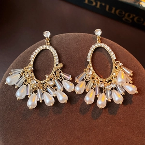Vintage gold oval earrings with dazzling rhinestones and white pearl fringe tassels