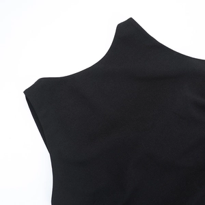 Close-up of black mesh stitching detail on sleeveless backless boat neck maxi dress