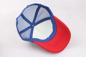 Detail view showing the red foam front, blue mesh back, and white inner lining of the hat