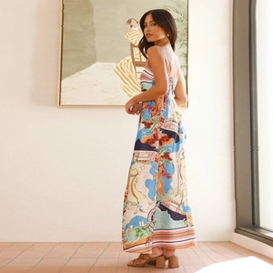 Artistic landscape print detail on a flowy backless maxi dress for beach vacations