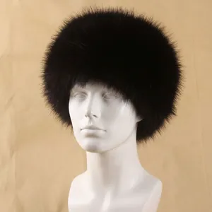 Close-up of black faux fox fur hat on a mannequin head for winter warmth and style